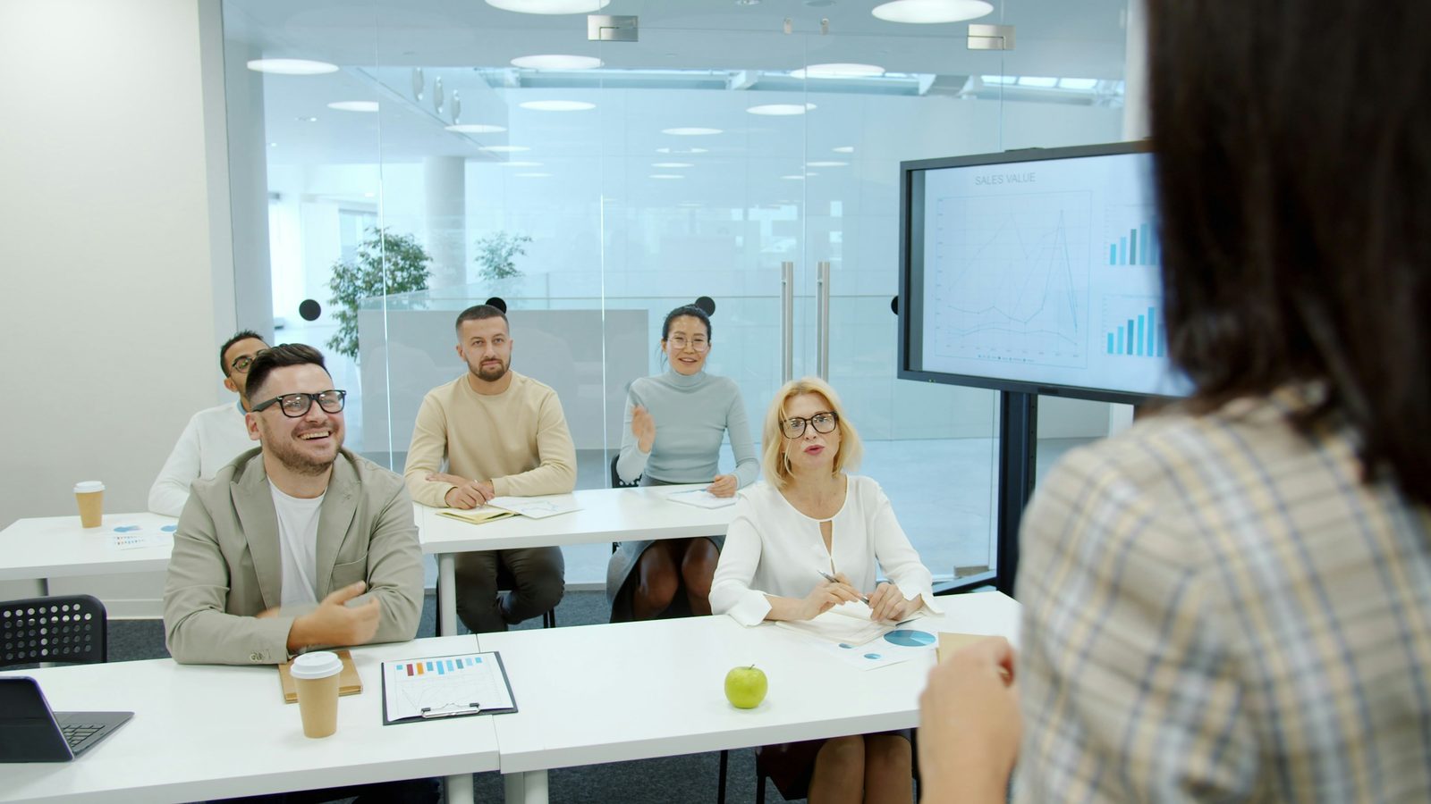 A trainer leading a room through a workshop